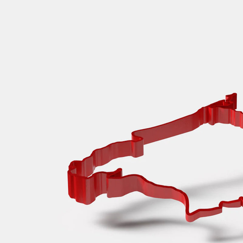 Red 3D printed Formula 1 circuit model showing raised track depth and layered contour detail
