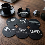 Formula 1 team logo coasters set with holder displayed on desk with coffee cup and car key lifestyle setup