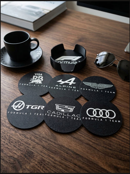 Formula 1 team logo coasters set with holder displayed on desk with coffee cup and car key lifestyle setup