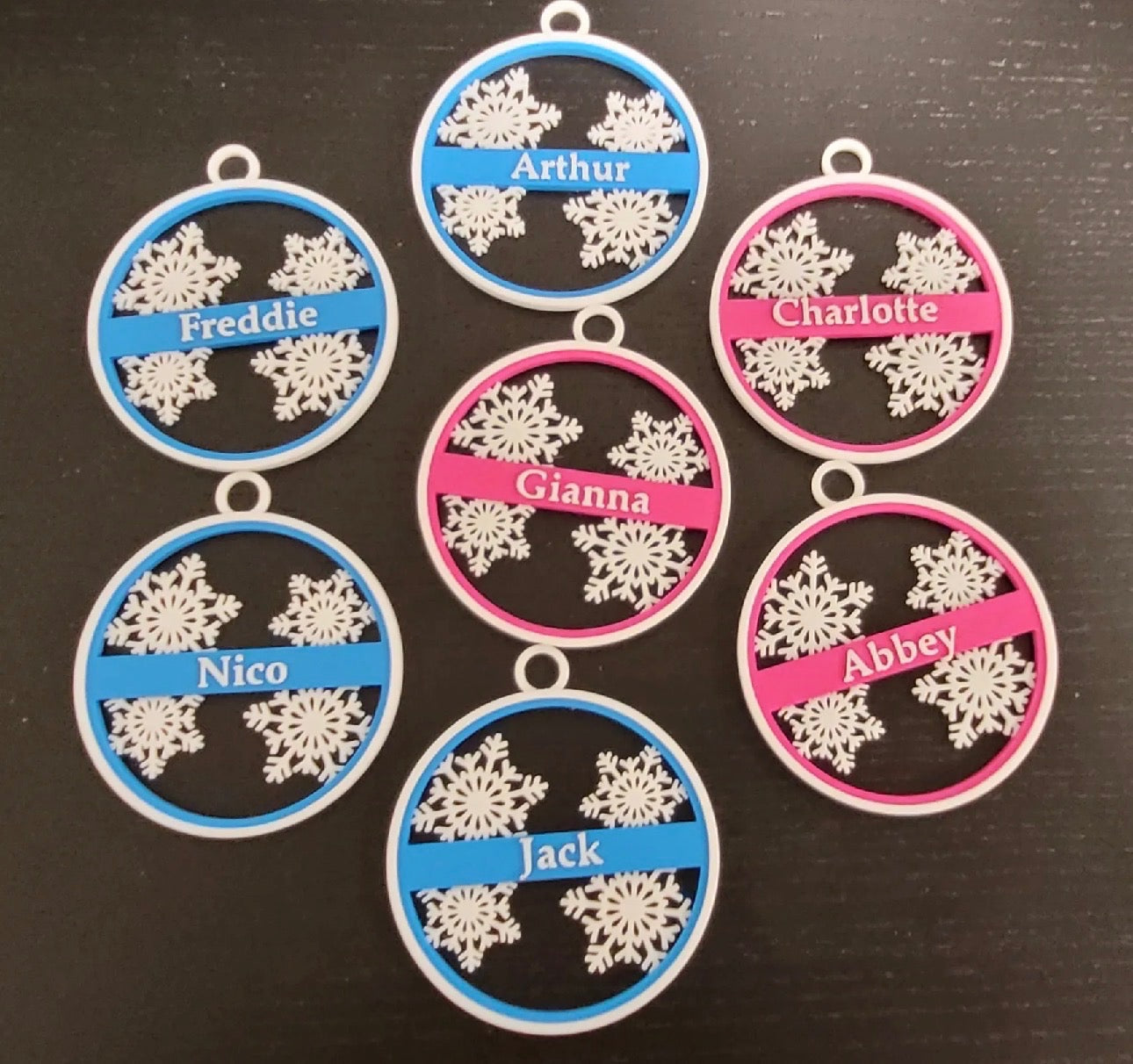 Custom name snowflake ornament in blue and green holiday colors