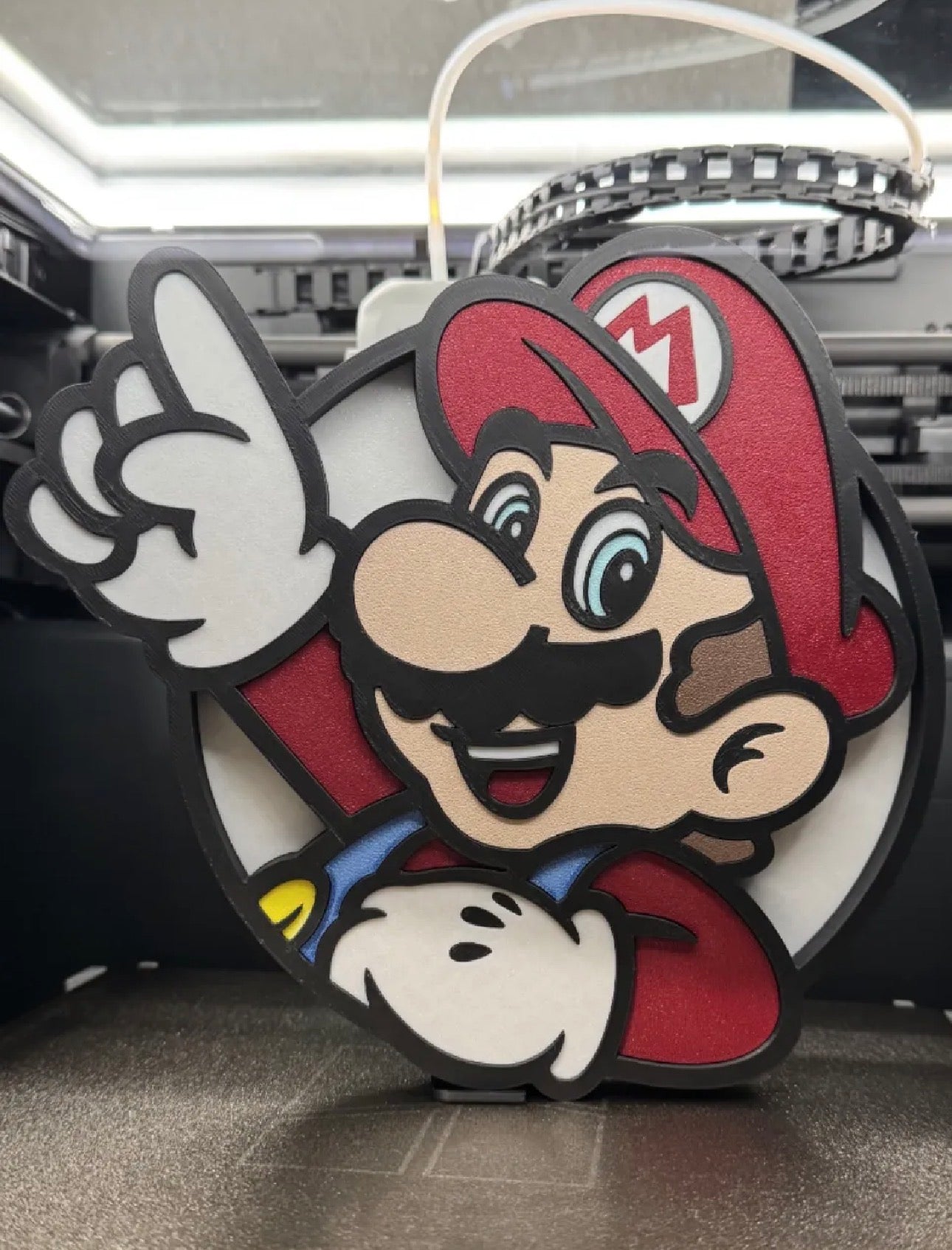 Multicolor 3D printed Mario decor standing on desk