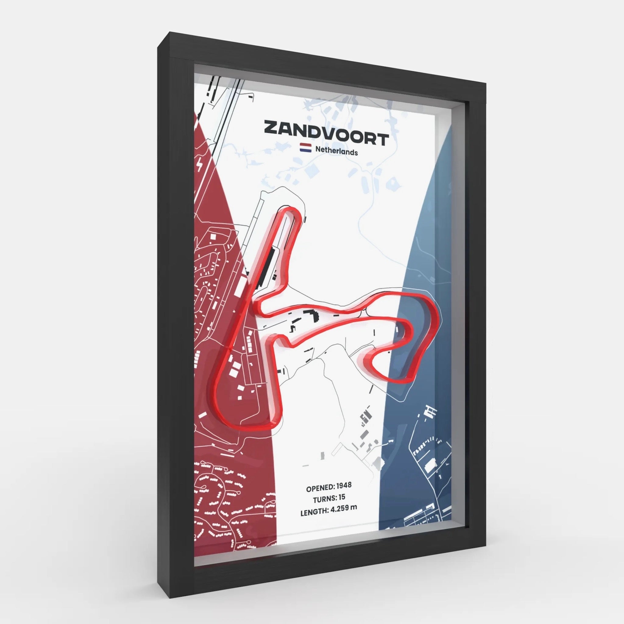 A framed Zandvoort motorsport map print with a red track outline, shown at an angle against a light gray background. The print features a black frame and includes text such as 'ZANDVOORT', 'Netherlands', and track details.
Dutch Grand Prix track framed wall art front view