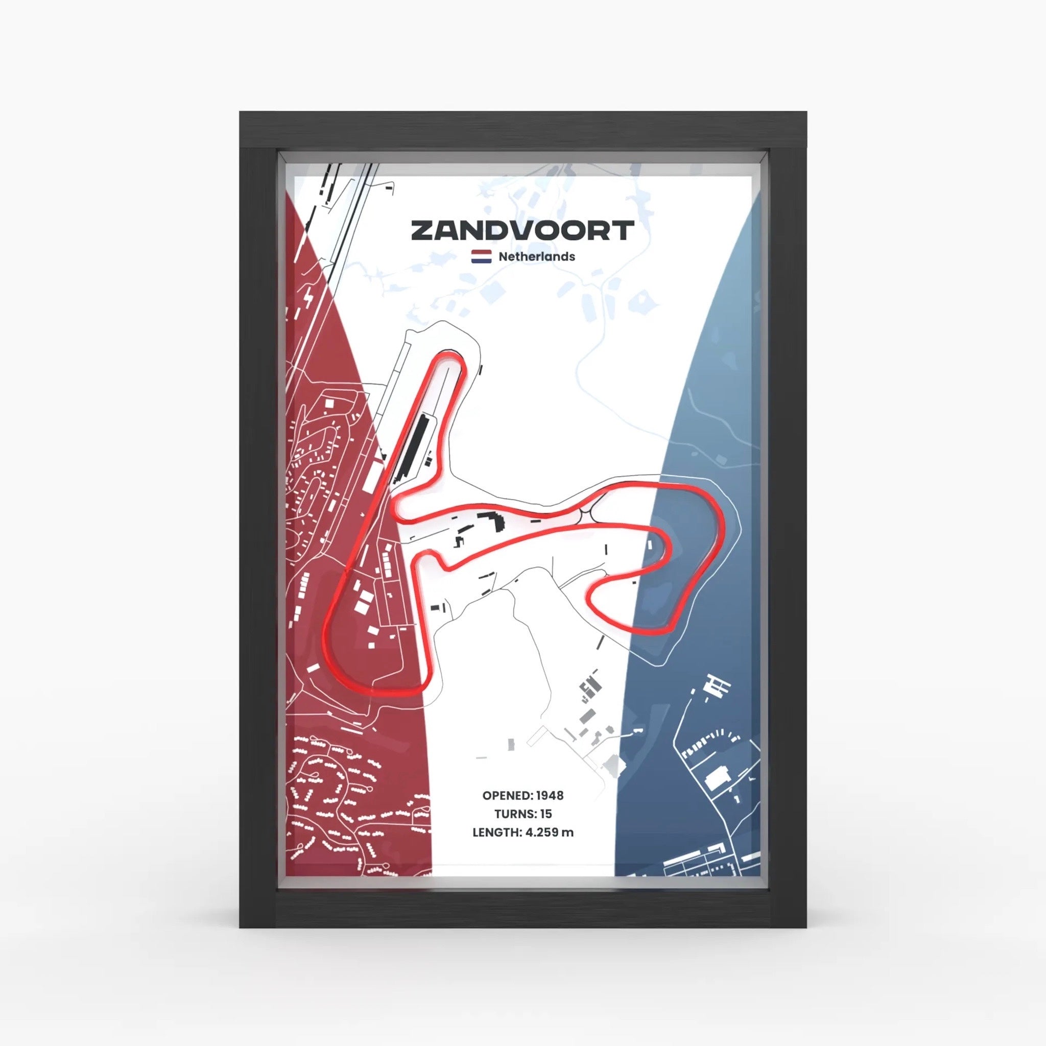 A framed Zandvoort motorsport map print featuring a red track outline over a white, blue, and red background, displayed in a black frame against a light gray studio background.
Dutch Grand Prix track framed wall art front view