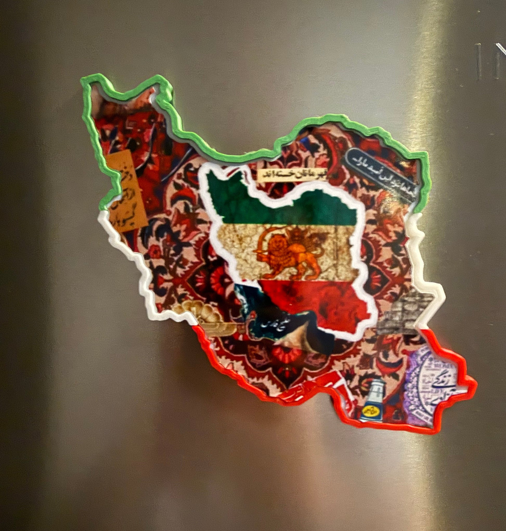 Fridge magnet shaped like  map of Iran with cultural elements on fridge