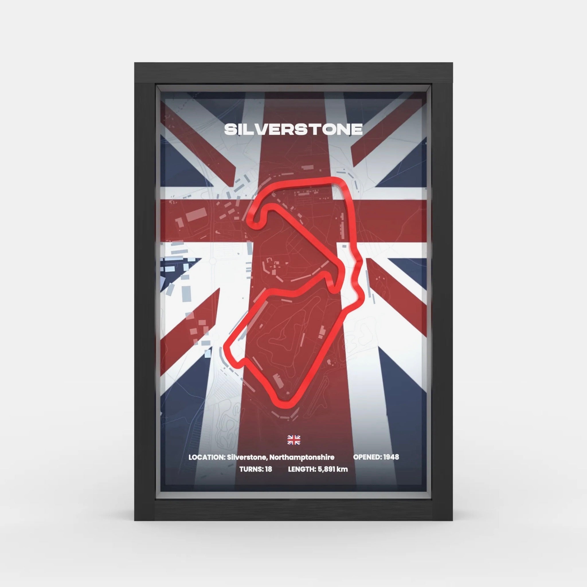 A framed poster of the Silverstone motorsport track, featuring a red track outline over a Union Jack flag background, presented in a black frame against a light gray background.
Silverstone Formula 1 track framed wall art front display