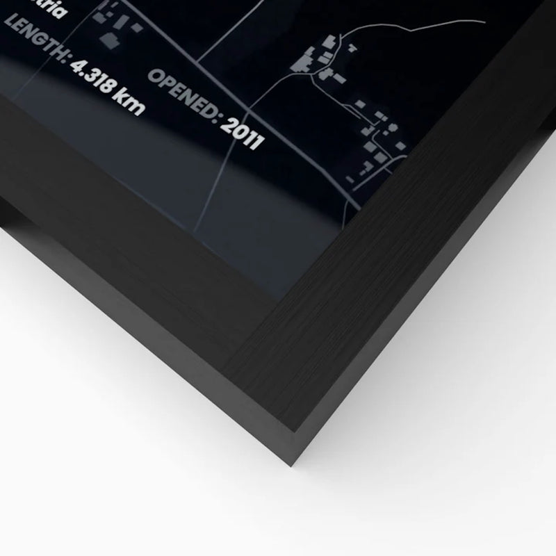 Close-up of black wooden frame corner featuring premium Formula 1 circuit artwork under a smooth front panel