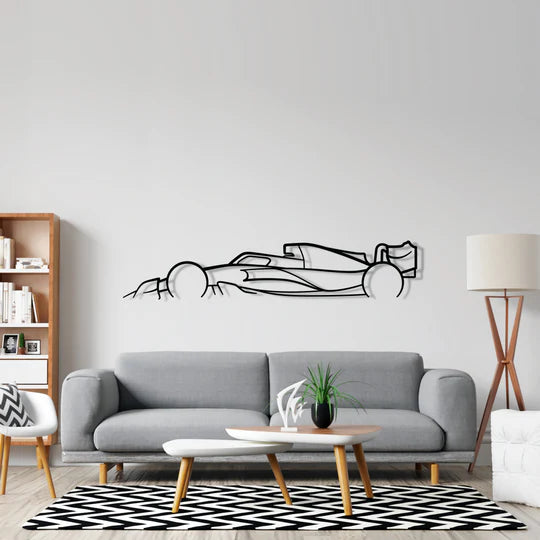 Living room with a gray sofa, coffee table, and wall decal of a race car.