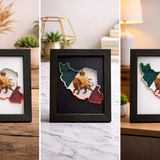 “Iran map 3D wall art in black frame with lion and sun design on a desk”
