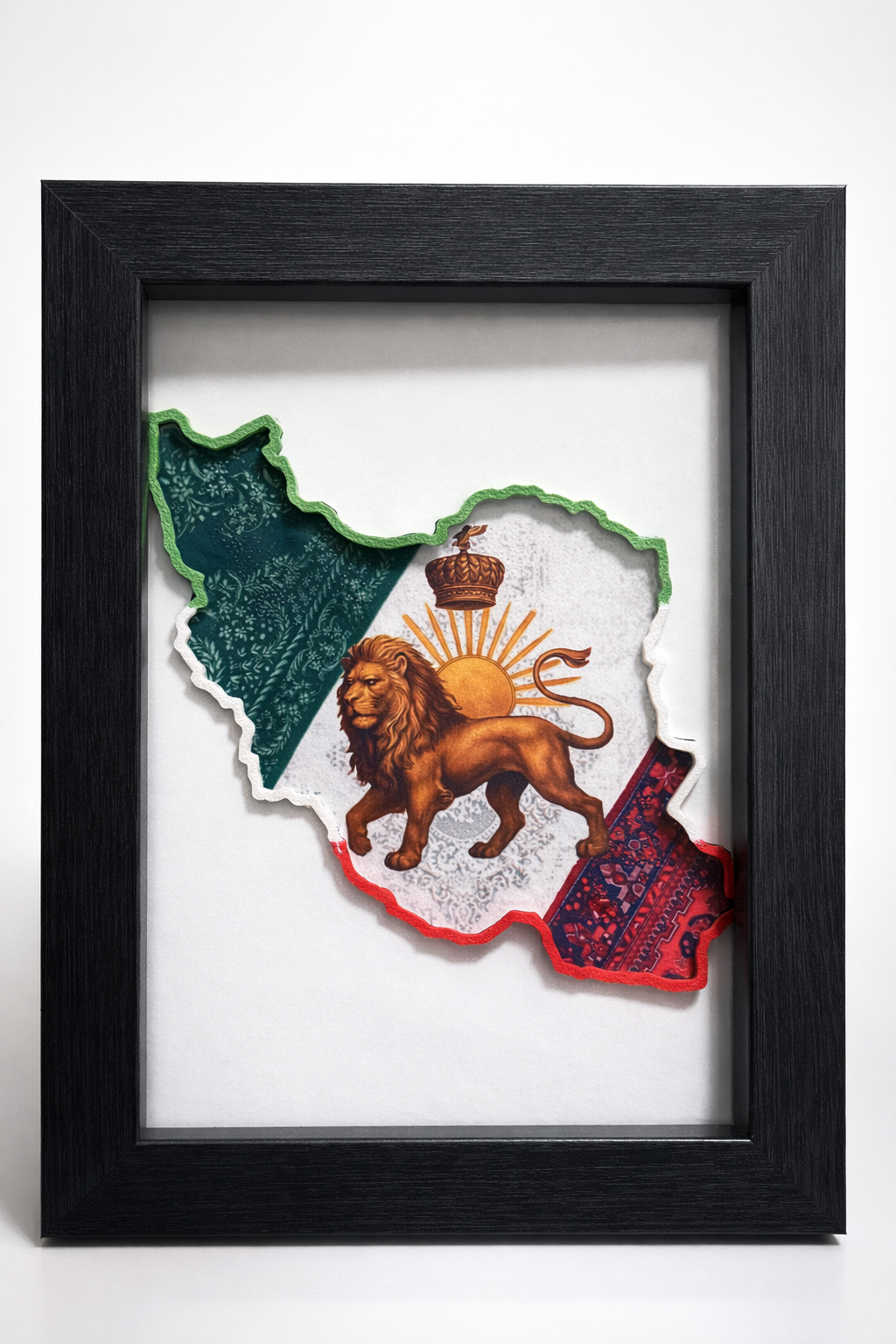 “Iran map 3D wall art in black frame with lion and sun design on a desk”
