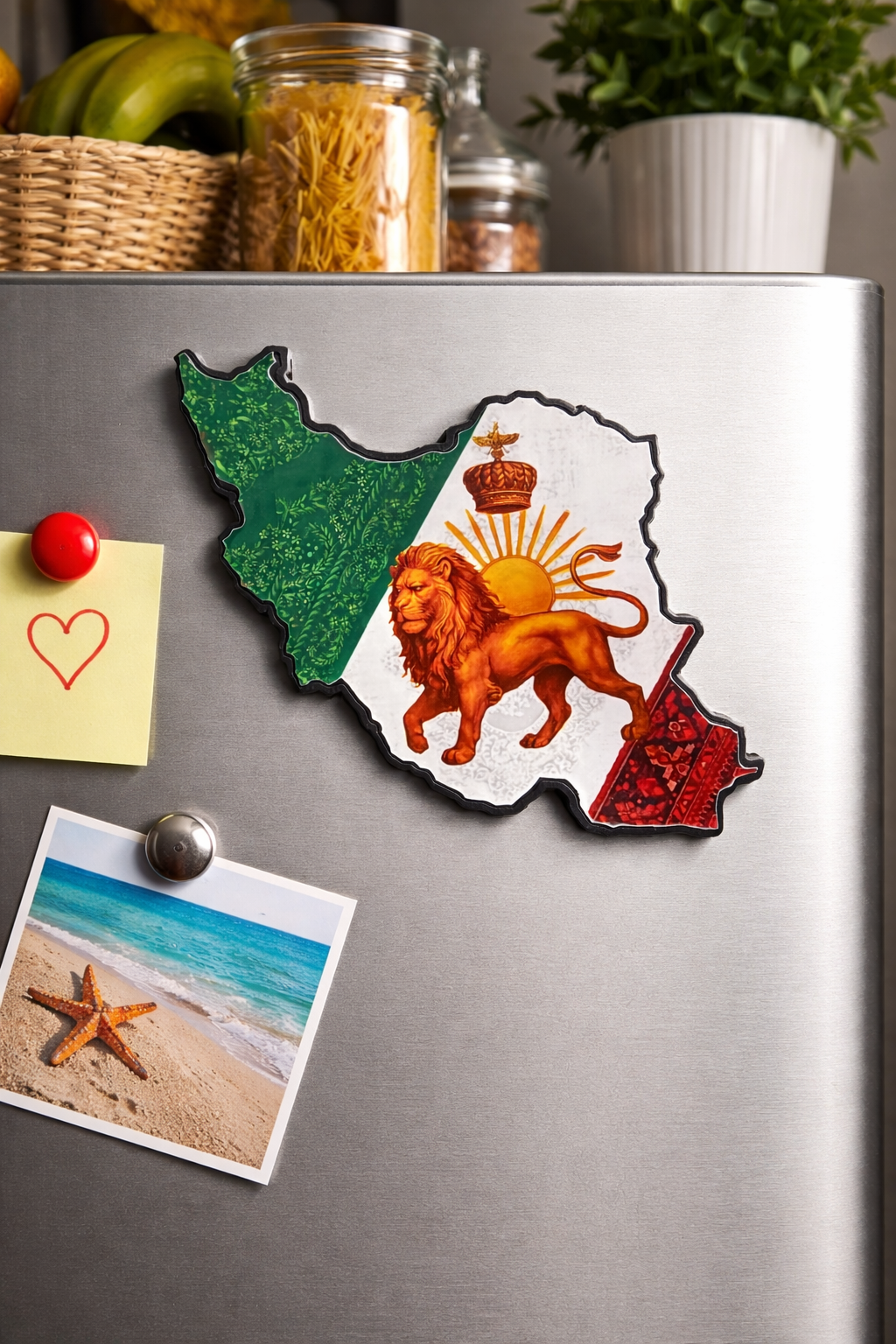 Fridge magnet of a lion and sun design on a refrigerator with other magnets and a plant in the background.